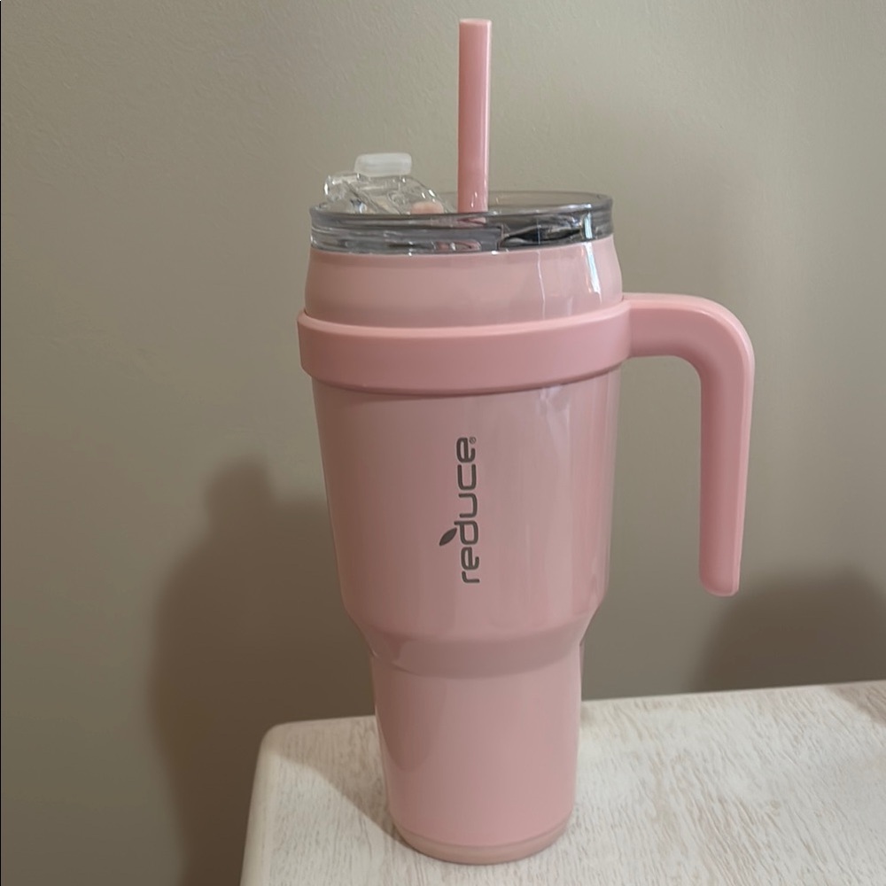 Reduce Pink Tumbler with Handle